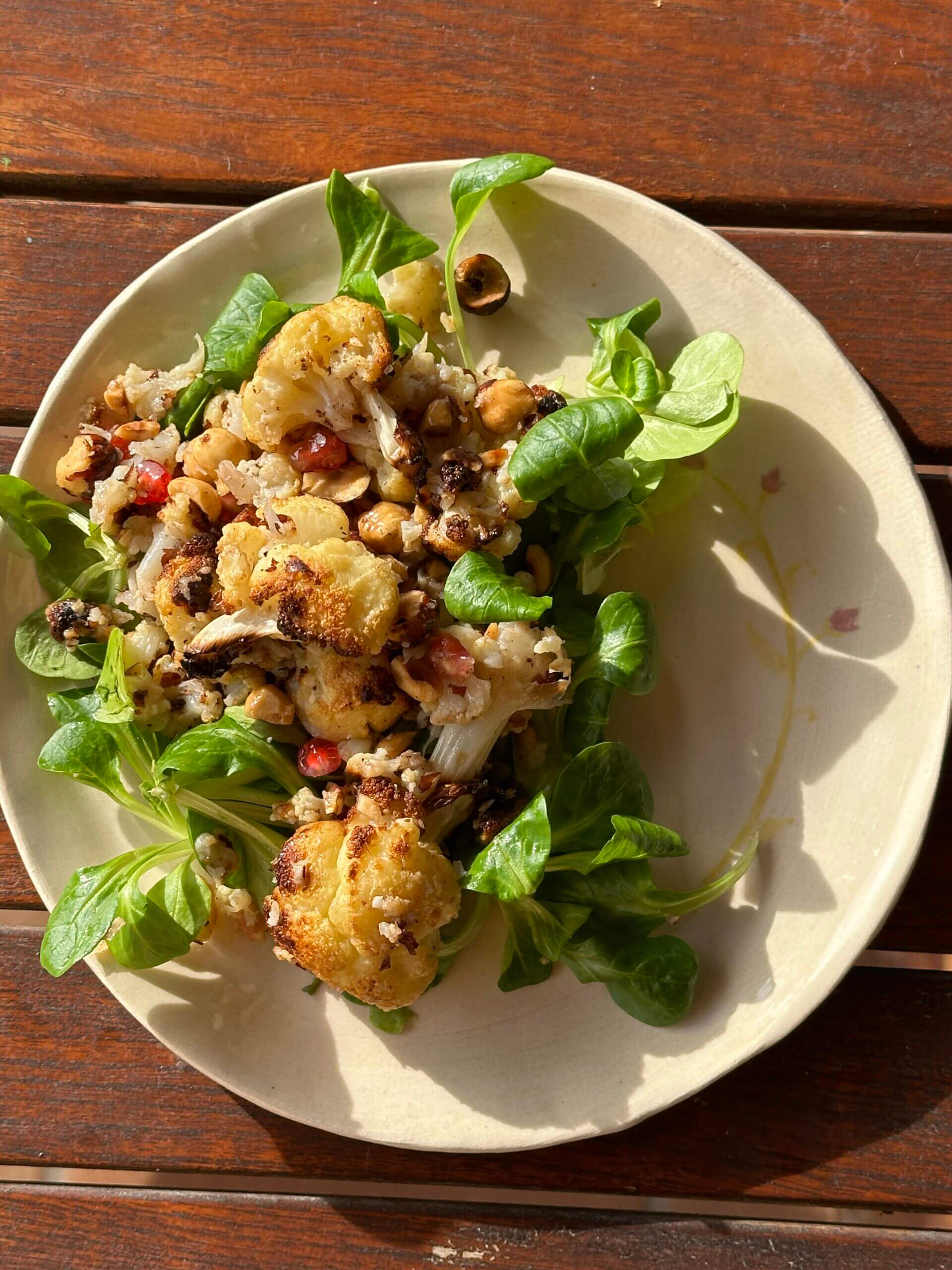 Warm Cauliflower Pomegranate Salad with Roasted Hazelnuts